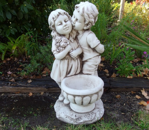 Boy & Girl Kissing By Pot