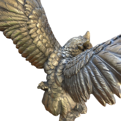 Bronze Owl Taking Flight