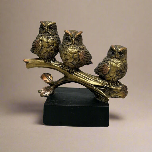 Bronze Owls On Branch